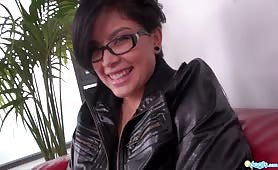 Amazing asian girl fucks her twat with her fingers on a red couch